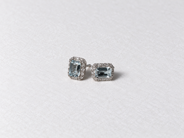 Blue emerald cut gemstone halo silver stud earrings view 2