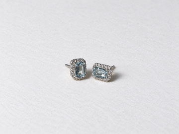 Blue emerald cut gemstone halo silver stud earrings view 3