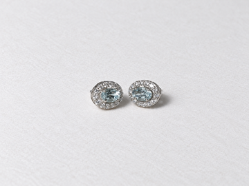 Blue oval gemstone halo silver stud earrings view 2