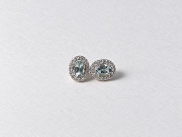 Blue oval gemstone halo silver stud earrings view 3