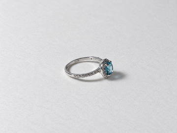 Blue topaz halo silver ring side view