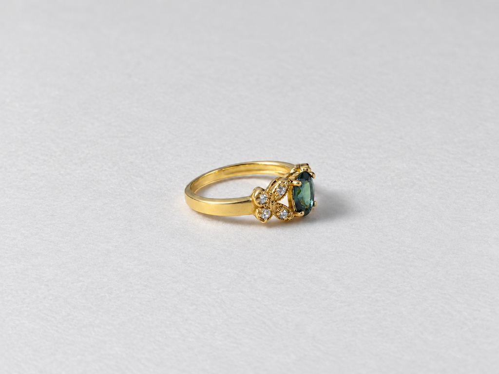 Green gemstone gold ring side view