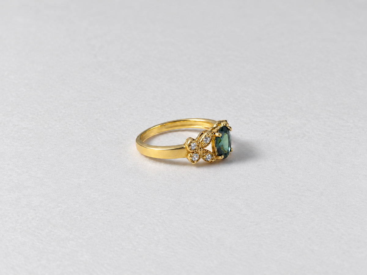 Green gemstone gold ring side view