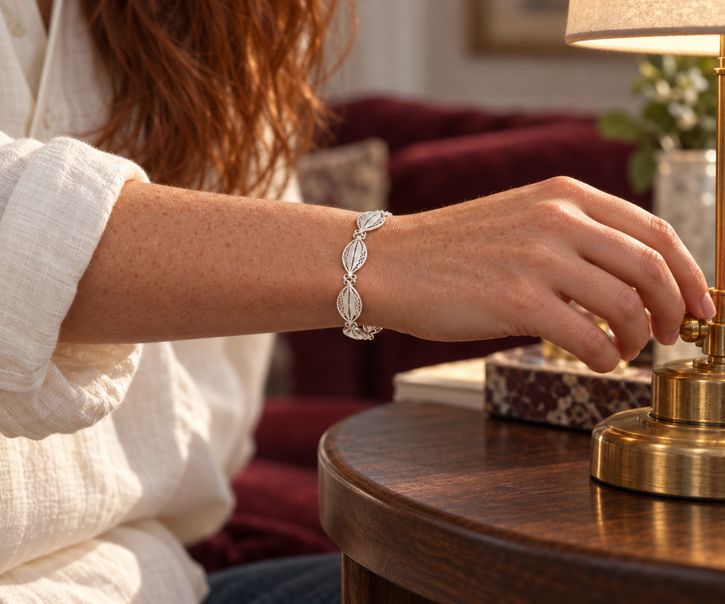 Handcrafted silver leaf bracelet worn close-up