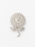 Handcrafted silver floral brooch detail