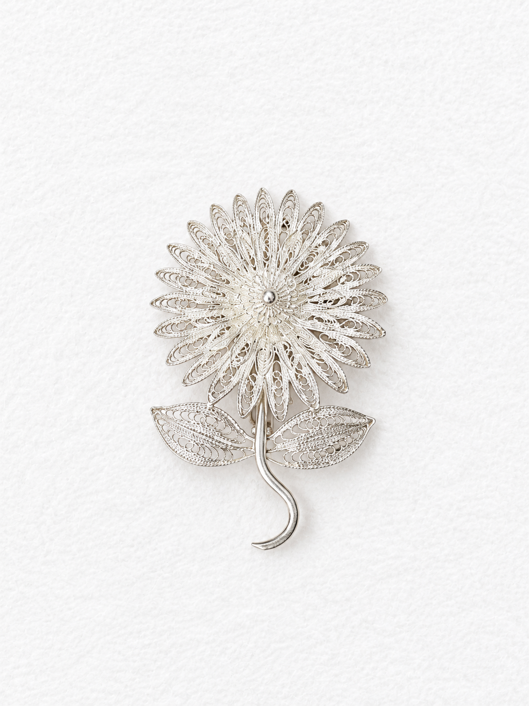 Handcrafted silver floral brooch detail