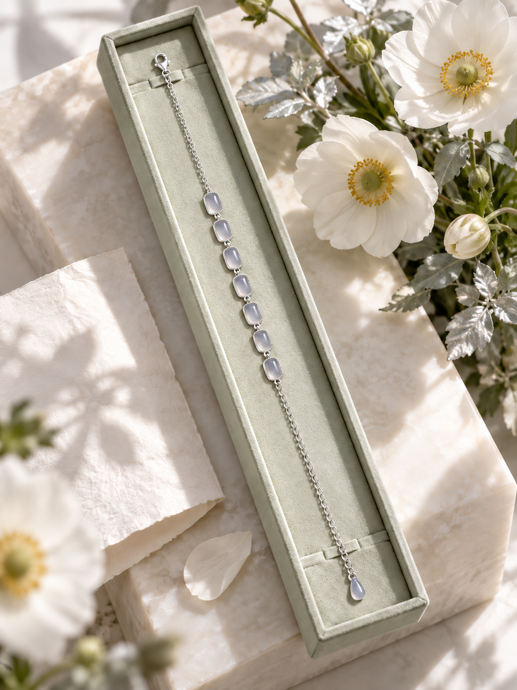 Hetian Jade Jewelry 03 bracelet displayed in green jewelry box with white flowers