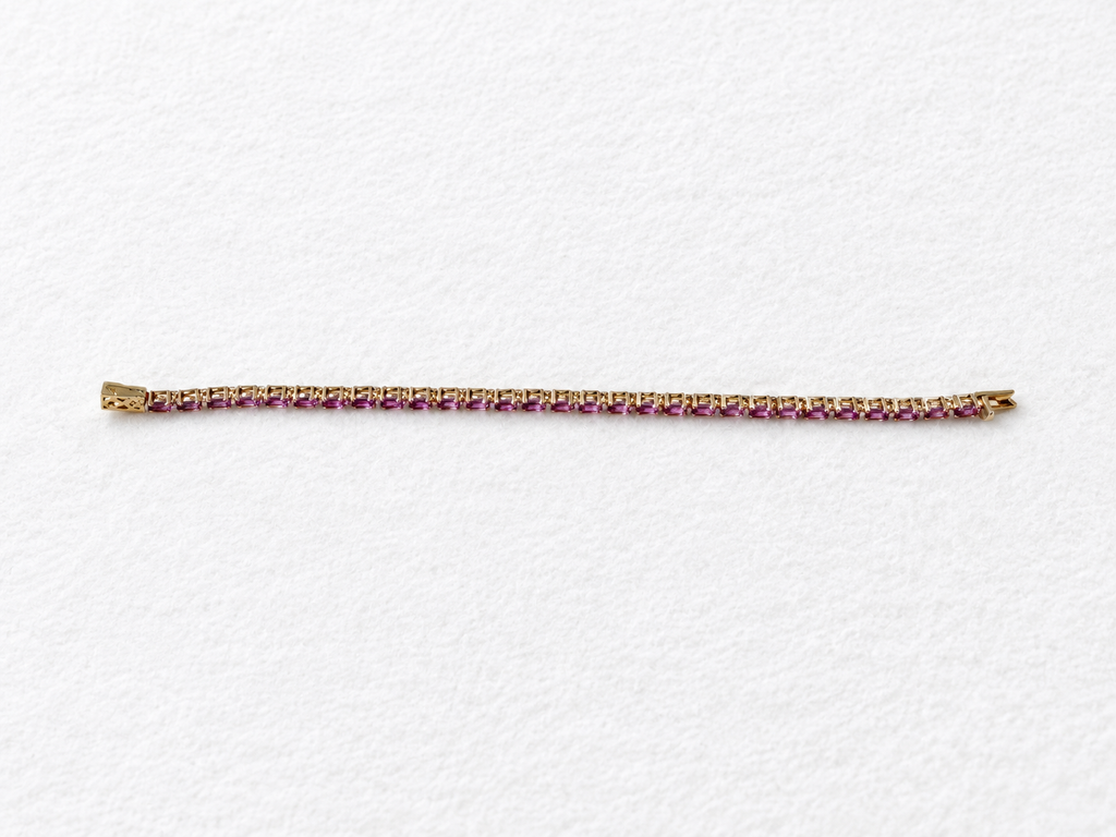 Pink gemstone gold bracelet view 1