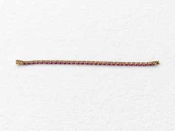 Pink gemstone gold bracelet view 1