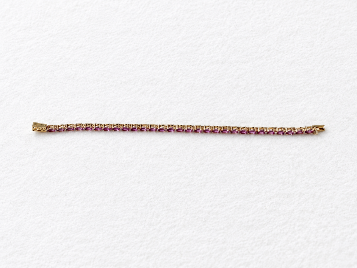 Pink gemstone gold bracelet view 1