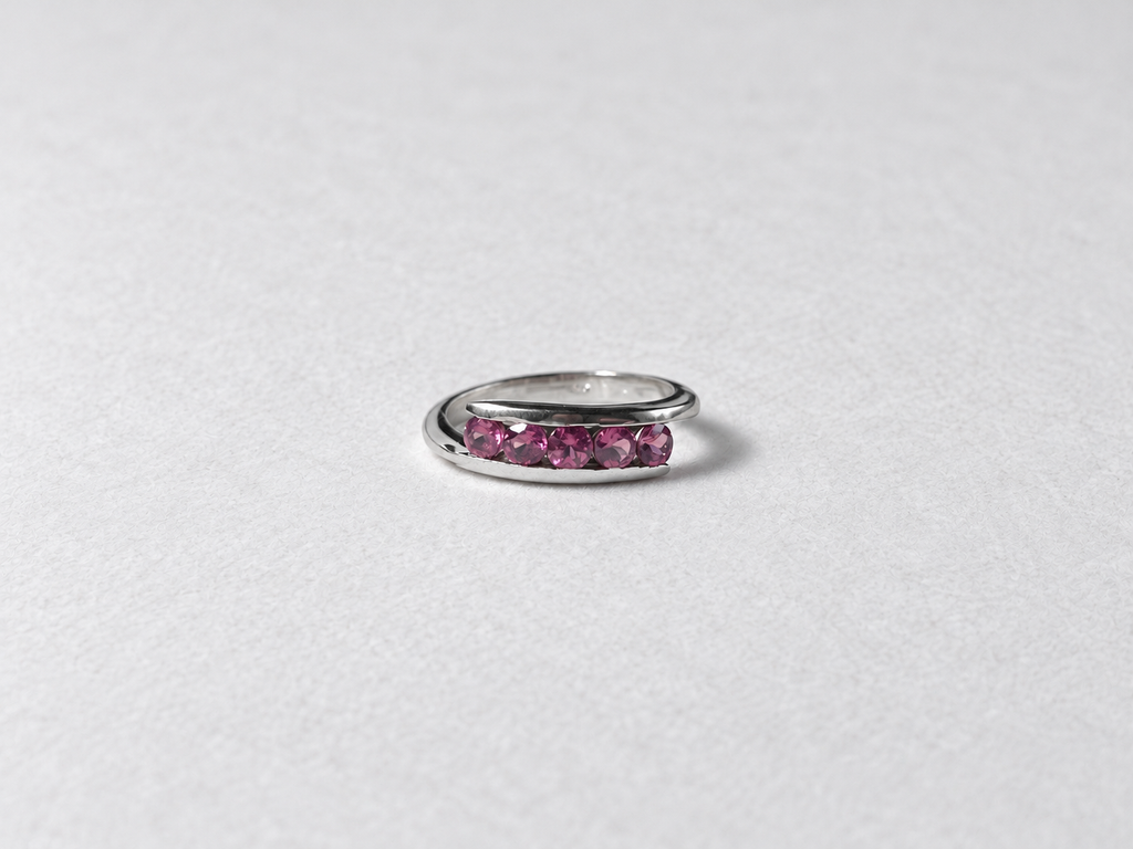 Pink gemstone silver band ring front view