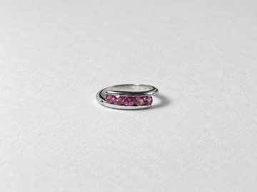 Pink gemstone silver band ring front view