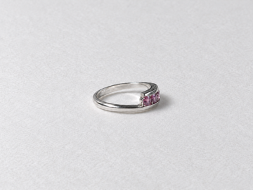 Pink gemstone silver band ring side view