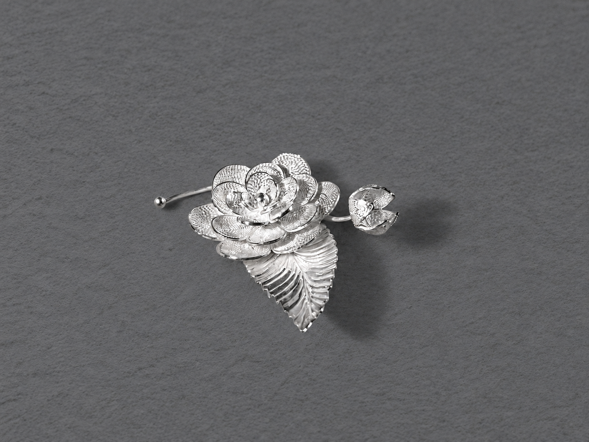 Silver floral leaf brooch detail view